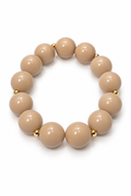 Brazalete beige con detalles de acero inoxidable