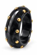 Brazalete de resina negro con detalles dorados