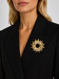Broche dorado sol