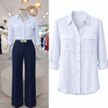 Blusa Celeste claro con bolsas manga tres cuartos